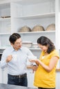 Happy expectant couple in the kitchen Royalty Free Stock Photo