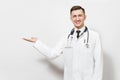 Happy experienced handsome young doctor man isolated on white background. Male doctor in medical gown, stethoscope Royalty Free Stock Photo