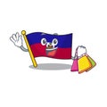 Happy face flag haiti Scroll mascot style waving and holding Shopping bag Royalty Free Stock Photo