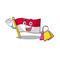 Happy face flag monaco Scroll mascot style waving and holding Shopping bag