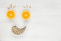 Happy face of fruit and seeds. The smiling face is made from oranges, garlic and sunflower seeds. Background of useful antiviral Royalty Free Stock Photo