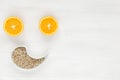 Happy face of fruit and seeds. The smiling face is made from oranges and sunflower seeds. Background of useful antiviral products Royalty Free Stock Photo