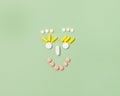 Happy Face Made of Variety Pills on Green Background Top View Copy Space Medical Concept Royalty Free Stock Photo