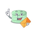 Happy face pistachio macaron mascot design with envelope