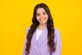 Happy face, positive and smiling emotions of teenager girl. Children studio portrait on yellow background. Childhood