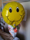 Happy faced get well balloon in hospital room