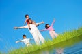 Happy famili, meadow, river Royalty Free Stock Photo