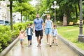 Happy familly of five in the park