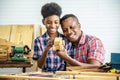 Happy family african american father and son carpenter gather craft a car out of wood and play, family concept to stay at home Royalty Free Stock Photo