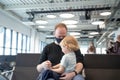 Happy family at the airport waiting for their departure Royalty Free Stock Photo