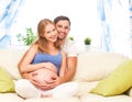 Happy family in anticipation of the birth of baby. Pregnant woma Royalty Free Stock Photo