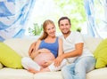 happy family in anticipation of the birth of baby. Pregnant woman and her husband at home Royalty Free Stock Photo