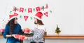 Happy family Asia family wear santa claus hat unwrap Christmas g Royalty Free Stock Photo