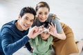 Happy family, Asian little daughter playing jigsaw puzzle with her mother and father for family concept, They assembling Jigsaw Royalty Free Stock Photo