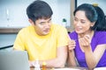 Happy family. Asian lovely couple, beautiful woman and handsome man are having breakfast in the kitchen Royalty Free Stock Photo