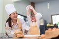 Happy family asian mom and son making bakery cake prepare delicious sweet food Royalty Free Stock Photo