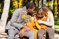 Happy family in autumn park. African American family: black father, mom and child boy on nature in fall. Royalty Free Stock Photo