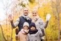 Happy family in autumn park Royalty Free Stock Photo