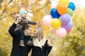 Happy family in autumn park Royalty Free Stock Photo