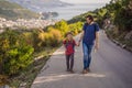 Happy family on the background of Panoramic view of the city of Budva, Montenegro. Beautiful view from the mountains to Royalty Free Stock Photo