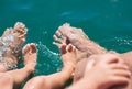 Happy family. Bare feets in the water of the sea boy, mother, father. Positive human emotions, feelings, joy. Funny cute child