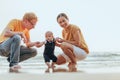 Happy family on the beach.  Father, mother and baby having fun on summer vacation. Holiday travel concept Royalty Free Stock Photo