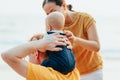 Happy family on the beach.  Father, mother and baby having fun on summer vacation. Holiday travel concept Royalty Free Stock Photo