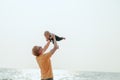 Happy family on the beach.  Father, mother and baby having fun on summer vacation. Holiday travel concept Royalty Free Stock Photo