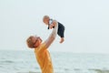 Happy family on the beach.  Father, mother and baby having fun on summer vacation. Holiday travel concept Royalty Free Stock Photo