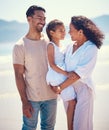 Happy family, beach and hug of a mother, father and girl together by the ocean. Nature, sea and love of a mom, dad and Royalty Free Stock Photo