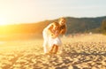 Happy family at beach. mother and child daughter run, laugh and Royalty Free Stock Photo