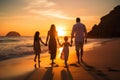 Happy family on the beach at sunset. Family vacation and travel concept, A happy family in walks hand in hand down a paradise Royalty Free Stock Photo