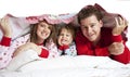 Happy Family in bed Royalty Free Stock Photo