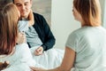 Happy family on bed suffering from cold Royalty Free Stock Photo