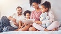 Happy family, bed and tablet streaming, movies or games while bonding, relax and play in their home. Online Royalty Free Stock Photo