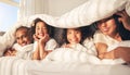 Happy family, bed and under blanket in home bedroom while comfortable, portrait and together. African woman, man and Royalty Free Stock Photo