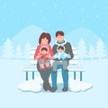 Happy family on bench in winter landscape Royalty Free Stock Photo