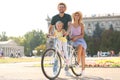 Happy family with bicycle outdoors