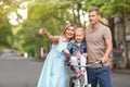 Happy family with bicycle outdoors