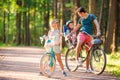 Happy family biking outdoors at the park