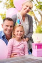 Happy family birthday moments. A cropped portrait of a happy little girl and her parents celebrating her birthday.