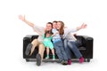 Happy family on black leather sofa Royalty Free Stock Photo