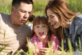 Happy family blowing soap bubbles in park Royalty Free Stock Photo