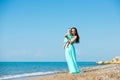 Happy family in a blue dress. Mother with baby on the beach Royalty Free Stock Photo