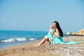 Happy family in a blue dress. Mother with baby on the beach Royalty Free Stock Photo