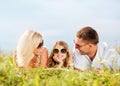 Happy family with blue sky and green grass Royalty Free Stock Photo