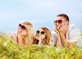 Happy family with blue sky and green grass Royalty Free Stock Photo