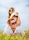 Happy family with blue sky and green grass Royalty Free Stock Photo