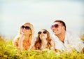 Happy family with blue sky and green grass Royalty Free Stock Photo