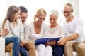 Happy family with book or photo album at home Royalty Free Stock Photo